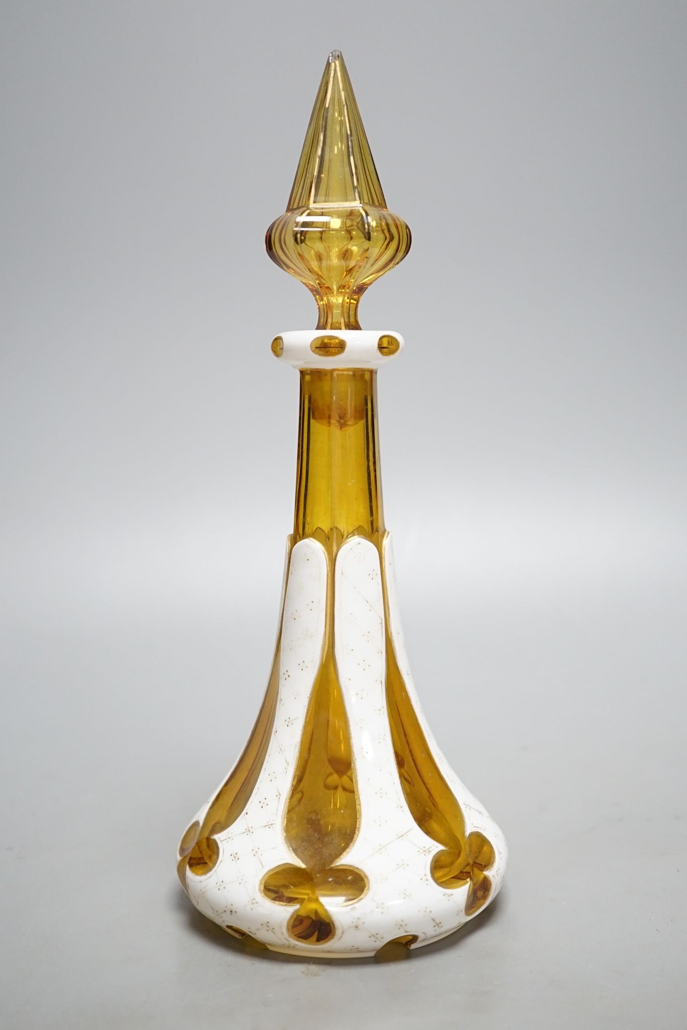 A Bohemian overlaid glass scent bottle, late 19th century, 26 cms high including stopper.